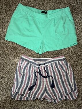 Women’s turquoise shorts & white, red, and blue striped boat shorts with tie